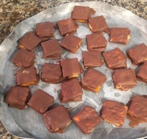 The butterfinger bites on a tray.