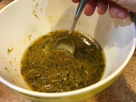 Dandelion Playdough - stirring the liquid with these additions