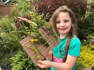 Nature Weaving - child holding his creation