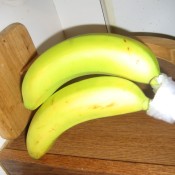 Wrap Banana Stems in Plastic - stem of bananas wrapped in plastic