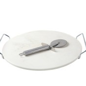 A pizza stone with a pizza cutter on top.
