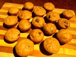 The muffins cooling on a cutting board.