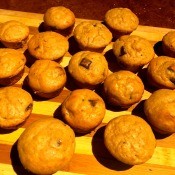 The muffins cooling on a cutting board.