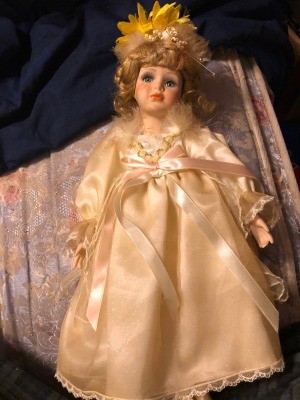 Value of a Geppeddo Doll? - doll in long cream colored dress in the box