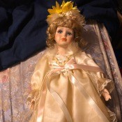 Value of a Geppeddo Doll? - doll in long cream colored dress in the box