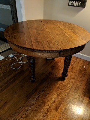 A round table with spiral legs and small casters