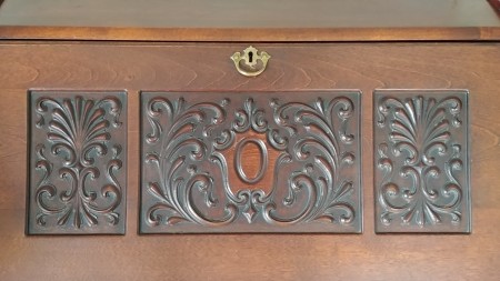 The top of an ornate wooden desk.