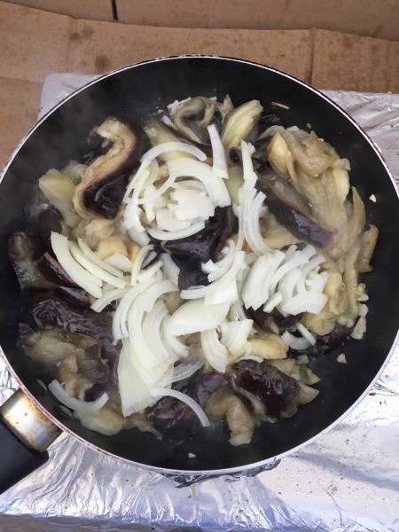 Sauteing onion with the eggplant mixture.