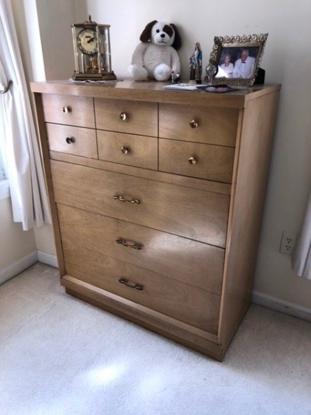 A wooden dresser with 4 drawers.