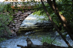 A rock bridge over a creek.