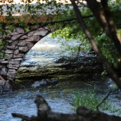 A rock bridge over a creek.