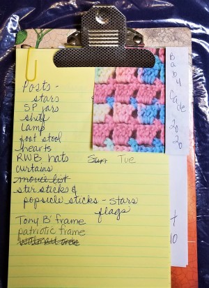 A clipboard with lots of different sized papers.