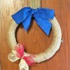 Simple and Fun Burlap Wrapped Country Wreath - wreath hanging on a door