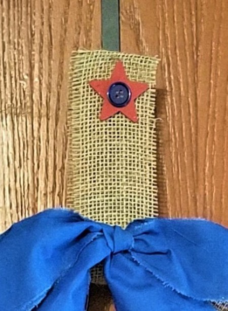 Simple and Fun Burlap Wrapped Country Wreath - burlap hanger with a red star with a blue button in the center