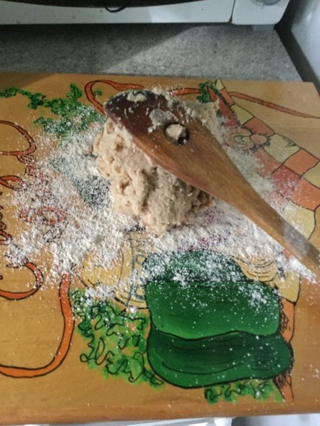 Placing the pie crust dough on a surface before rolling it out.