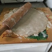 Rolling out the pie crust dough.