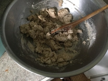 The pie crust mixture in a bowl.