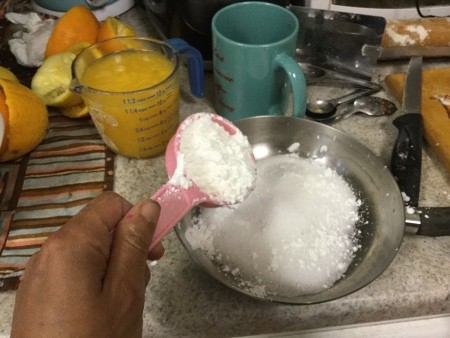 Adding ingredients to a saucepan.