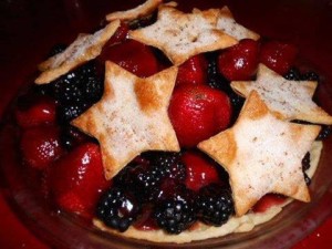 A fruit pie made from strawberries and blackberries, with cut out stars as the crust.