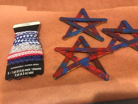 4th of July Craft Stick Star with Streamers - package of red, white, and blue ribbons next to the three stats