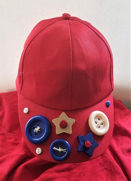 Red White and Blue Caps for the Fourth - red cap decorated with blue and white buttons