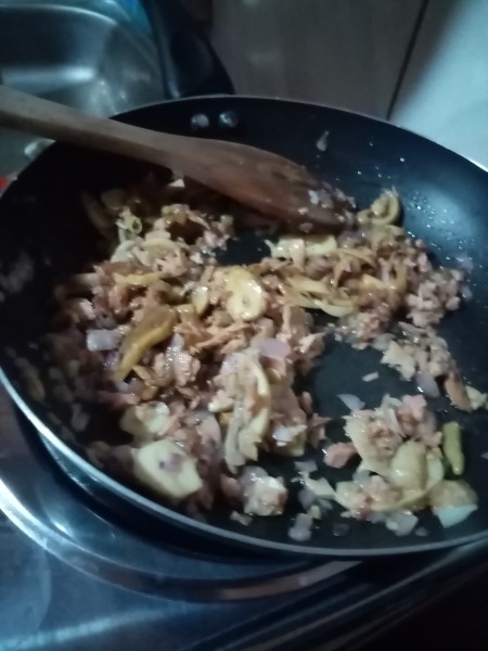 The mixture in the pan is cooked and combined.