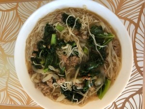 A finished bowl of pork noodle soup.