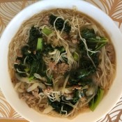 A finished bowl of pork noodle soup.