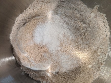 Adding ingredients to the mixing bowl.