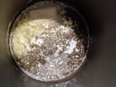 Adding ingredients to the mixing bowl.