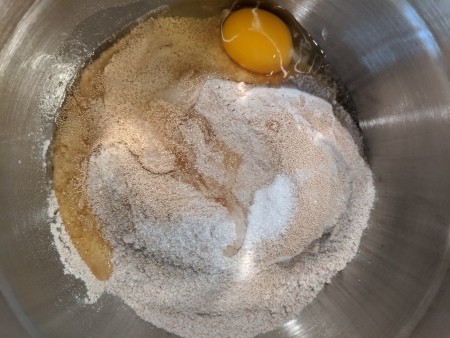 Adding ingredients to the mixing bowl.