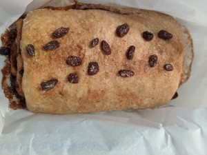 The baked loaf of cinnamon raisin bread.