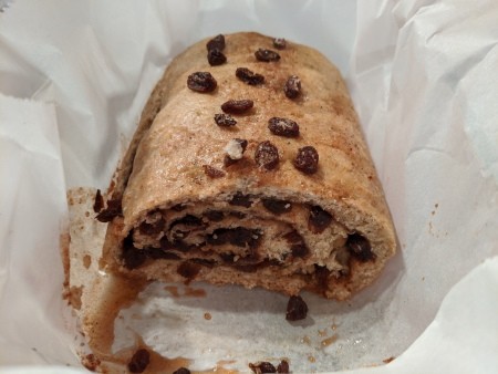 The rolled loaf of cinnamon raisin bread.