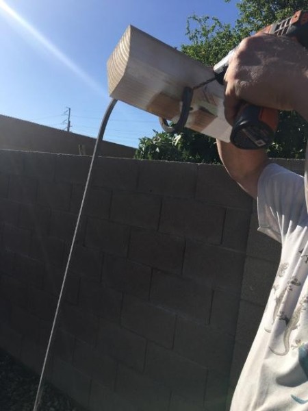 Ceramic Plate Flower Sculpture - drilling a hole through the wrought iron stake plant hanger