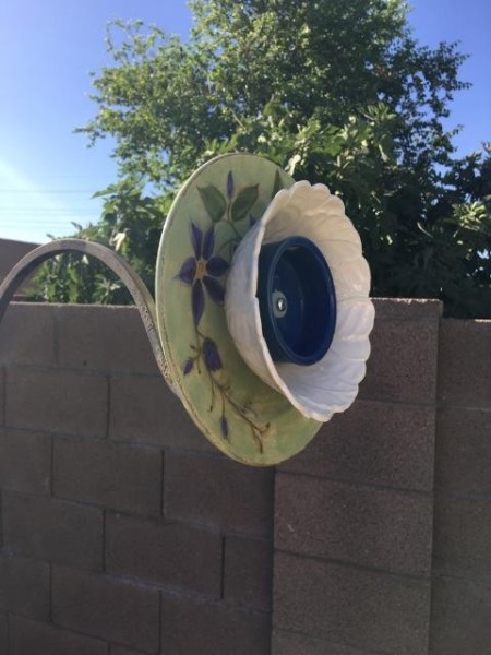 Ceramic Plate Flower Sculpture - ceramic flower bolted to the wrought iron