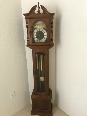 A wooden grandfather clock.