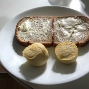 Two egg bites on a plate with toast.