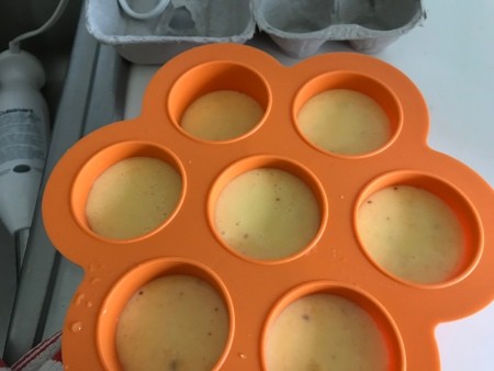 A orange silicone egg tray for the Instant Pot.