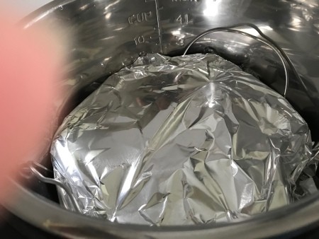 Aluminum foil covering the egg tray.