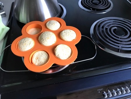 The egg tray with cooked egg bites.