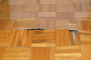 A damaged floor in need of repair.