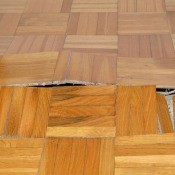 A damaged floor in need of repair.