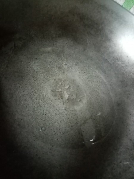 An empty large frying pan or wok.