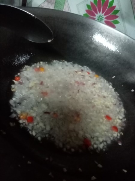 A large frying pan with the chopped vegetables added.