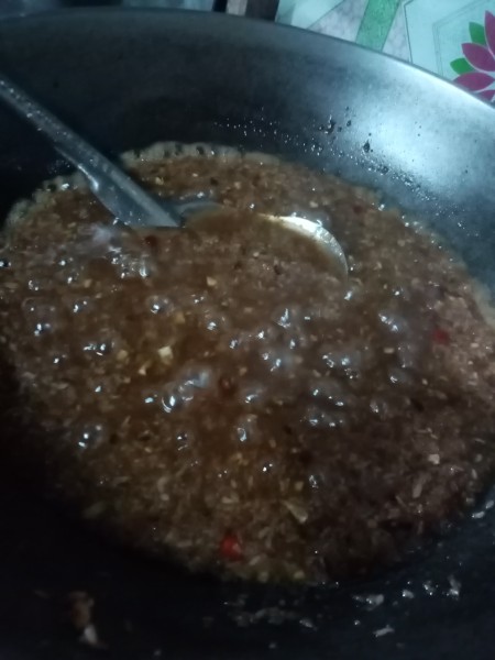 The mixture being cooked down to a paste consistency.