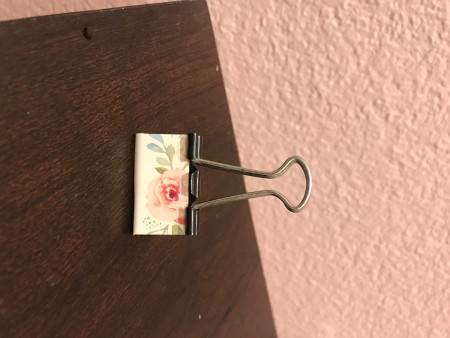 Binder Clip Photo Holder - clip lying on table top after being wrapped with the sticker