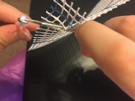 Latch Hook Rug Project Pillow - beginning stitch hook through the grid and hooked on yarn