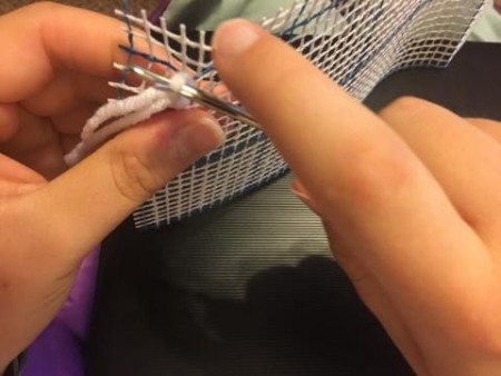 Latch Hook Rug Project Pillow - pulling yarn through