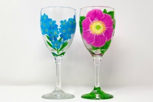 A pair of hand painted wine glasses.