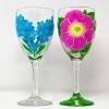 A pair of hand painted wine glasses.